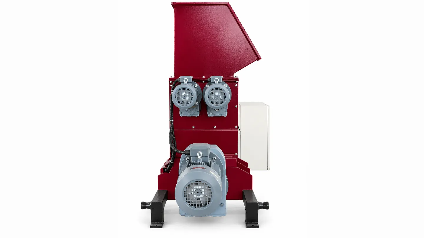 Side view of the EPS hot melt machine showing the hopper, drive assembly and heated section